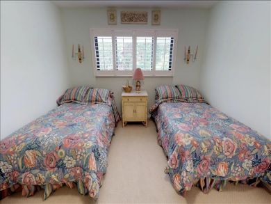 Just Steps to the Sandy Beach from this Two Bedroom Condo
